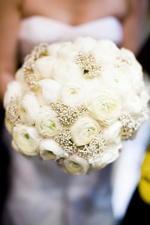 an all-white winter wedding bouquet of two types of blooms is amazing for a winter wedding