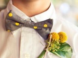 a playful grey and yellow polka dot bow tie with a billy ball boutonniere will spruce up any neutral outfit