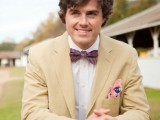 a tan suit, a white shirt, a pink printed bow tie and a colorful handkerchief for a stylish summer groom’s look