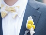 a grey suit, a white shirt, a white and yellow printed bow tie and a billy ball boutonniere to rock in spring or summer