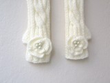 white cable knit mittens with fabric blooms are great for wearing at a Christmas or winter wedding