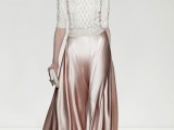 a refined winter bridal look with a white calbe knit sweater, a pink slip maxi skirt, a white clutch and statement earrings