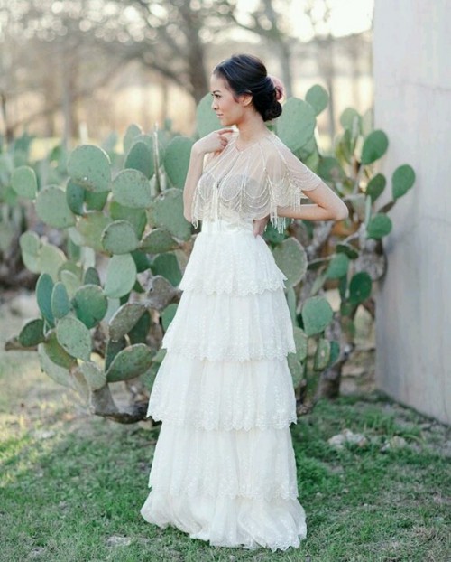 a bridal portrait and lots of cacti as a backdrop for a cool desert wedding or to show off that it's summer