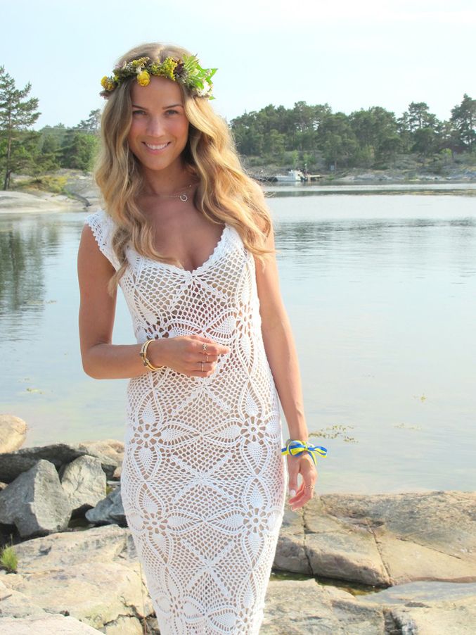 a boho crochet fitting wedding dress with thick straps and a deep neckline is a lovely idea for a boho bride