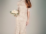 a grey crochet lace fitting maxi wedding dress with short sleeves and a high neckline, white shoes for a modest wedding look