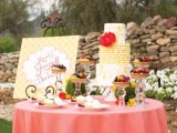 a lovely sweets table with moss balls and craspedia, tarts with fresh berries and a bright yellow cake for a garden bridal shower