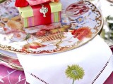 bright floral plates, a neutral napkin with an embroidered flower and a favor box in bold colors