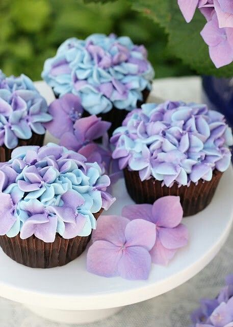 chocolate cupcakes with purple and blue sugar blooms are adorable and delicious for a garden bridal shower