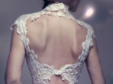 a fantastic fitting wedding dress with a lace bodice, a keyhole back with a smaller cutout, cap sleeves and a high neckline for a modern romantic bride