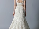 a vintage mermaid wedding dress with a high neckline, cap sleeves, a keyhole back and a short train for a vintage bride
