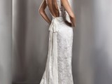 a romantic and formal sleeveless mermaid lace wedding dress with a keyhole back and a bow on the back plus a small train