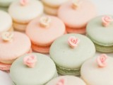 tender pastel spring macarons with sugar roses on top are nice sweets for a spring bridal shower