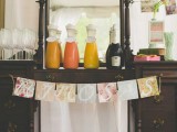 a vintage dresser as a drink table with a pastel bunting, some drinks and glasses is a lovely idea for a vintage bridal shower