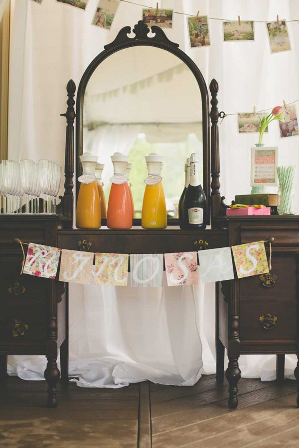 A vintage dresser as a drink table with a pastel bunting, some drinks and glasses is a lovely idea for a vintage bridal shower