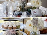 a vintage bridal shower table with a vintage stand with cupcakes, white blooms, vintage books stacked and a vintage clock is a great idea