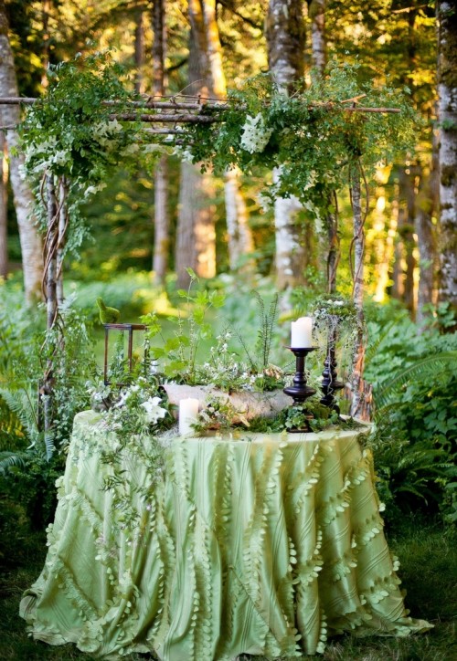 a simple and fresh branch wedding arch with much foliage and greenery is a lovely idea for a spring or summer wedding