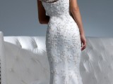 a catchy one shoulder lace mermaid wedding dress with a small train is a very romantic and girlish solution for a wedding