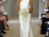 a refined minimalist plain wedding dress with a detail on the shoulder is a stylish ide for a sophisticated modern wedding