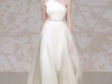 a one shoulder wedding dress with an embellished shoulder and a sash and embellished inserts for a very refined bride with a vintage touch