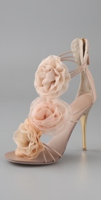 strappy blush shoes with large blush fabric blooms will give you an ethereal and chic look with a feminine feel
