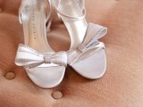 elegant white heeled sandals with embellished bows and ankle straps are a chic idea for a retro bridal look