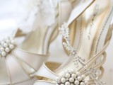 white strappy laser cut shoes with statement embellishments are a nice option for a vintage summer bridal look