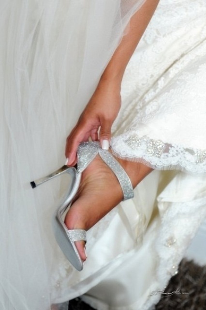 shiny silver fully embellished ankle strap heels are amazing for adding a touch of glam to a summer bridal look