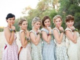 pastel floral vintage bridesmaid dresses with thick straps are a great idea for a vintage or retro wedding, floral bracelets and chic hairstyles finish off the looks