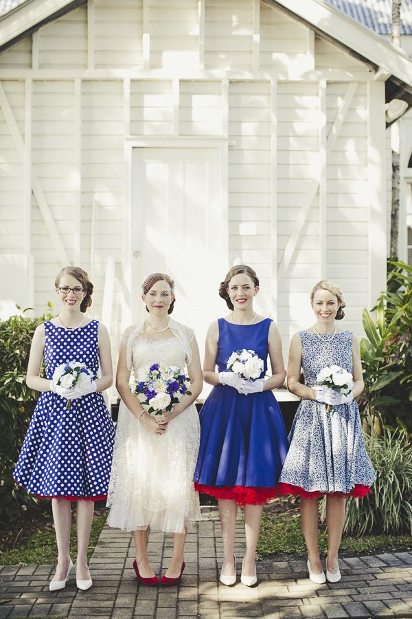 Mismatching blue A line midi dresses with various prints and full skirts are amazing for retro weddings, they look chic and cool