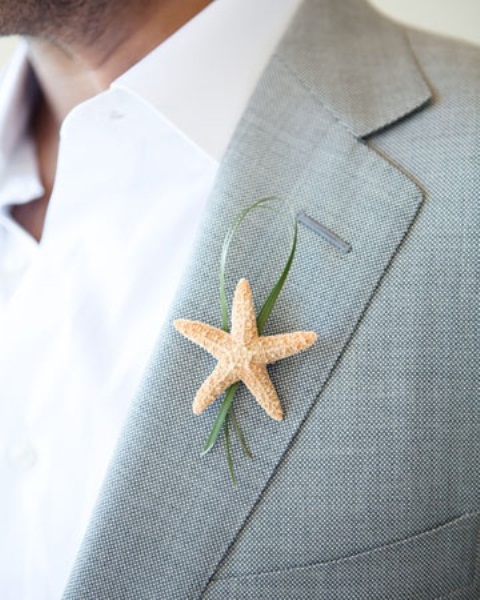 accent your beach attire with a little themed boutonniere to give a nod to your location