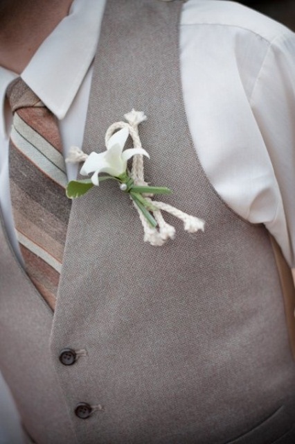 an ivory shirt, a striped tie, a light grey waistcoat and a beachy boutonniere won't make you feel too hot