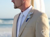 a tan suit, a white shirt and tie, a silver boutonniere will make your look fresh and chic