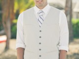 a tan suit with a vest, a striped tie, a shirt with rolled up sleeves is a comfy and not too formal option