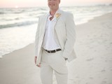 a creamy suit, a white shirt and a bold floral boutonniere for a relaxed yet formal enough outfit