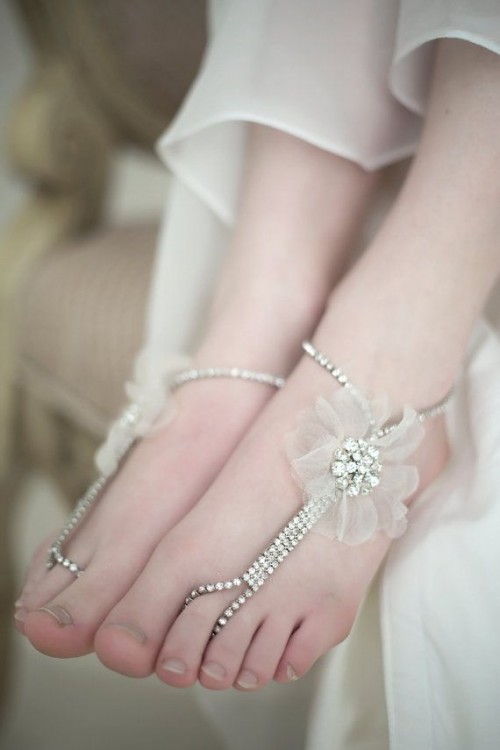 fully embellished barefoot wedding sandals with a tulle flower on one side are glam and super cute