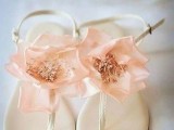 creamy flat beach wedding sandals topped with pink fabric blooms look very romantic and very delicate