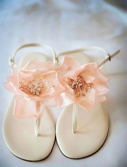 creamy flat beach wedding sandals topped with pink fabric blooms look very romantic and very delicate