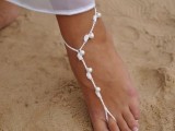 simple white thread and pearl barefoot beach wedding sandals are a slight accent to your beach bridal look