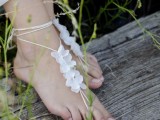 delicate lace up floral barefoot sandals are amazing for boho beach brides or for garden ones