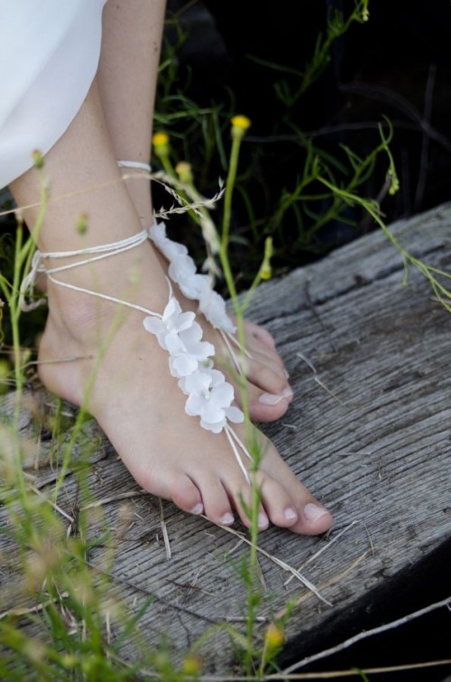 delicate lace up floral barefoot sandals are amazing for boho beach brides or for garden ones