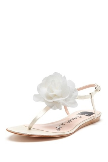 flat wedding sandals with large white fabric blooms on top look chic, ethereal and cool