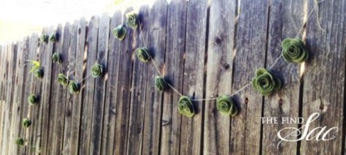a green felt rose garland is a cool decoration for a relaxed wedding, a DIY backyard one, for example