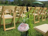 a pink peony with greenery in a jar is a great idea for decorating an outdoor barn wedding ceremony space