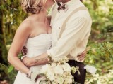 a stylish retro groom’s look with chocolate brown pants, a white button down, neutral suspenders, a printed bow tie and a cap