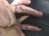 wedding date tattoos done with words and infinity signs put on the sides of the ring fingers