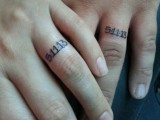 wedding date tattoos substituting usual wedding bands and done with usual numbers