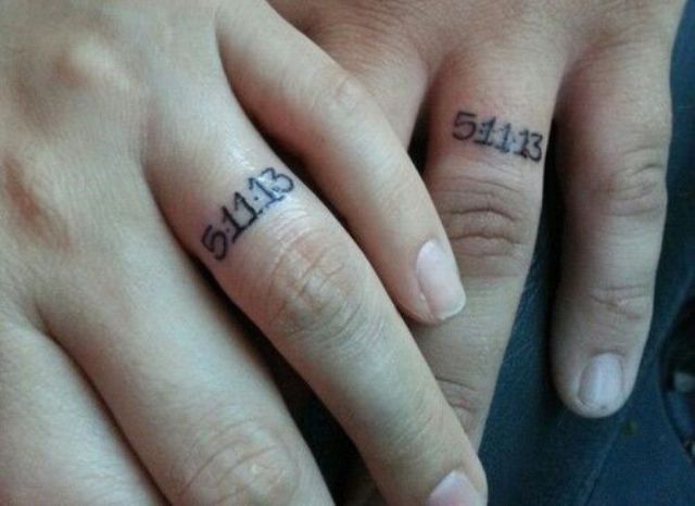 wedding date tattoos substituting usual wedding bands and done with usual numbers