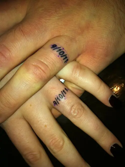 wedding date tattoos done with usual numbers as wedding bands on the ring fingers