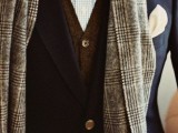 a navy tweed suit, a brown waistcoat, a printed shirt and a yellow polka dot bow tie, a grey checked scarf for a catchy winter look