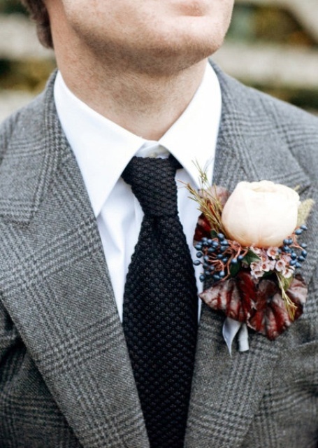 a grey tweed checked suit, a white button down, a black tie and a floral and berry boutonniere to refresh the look